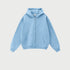 Light blue oversized zip-up hoodie with front kangaroo pocket and ribbed cuffs displayed on light gray background