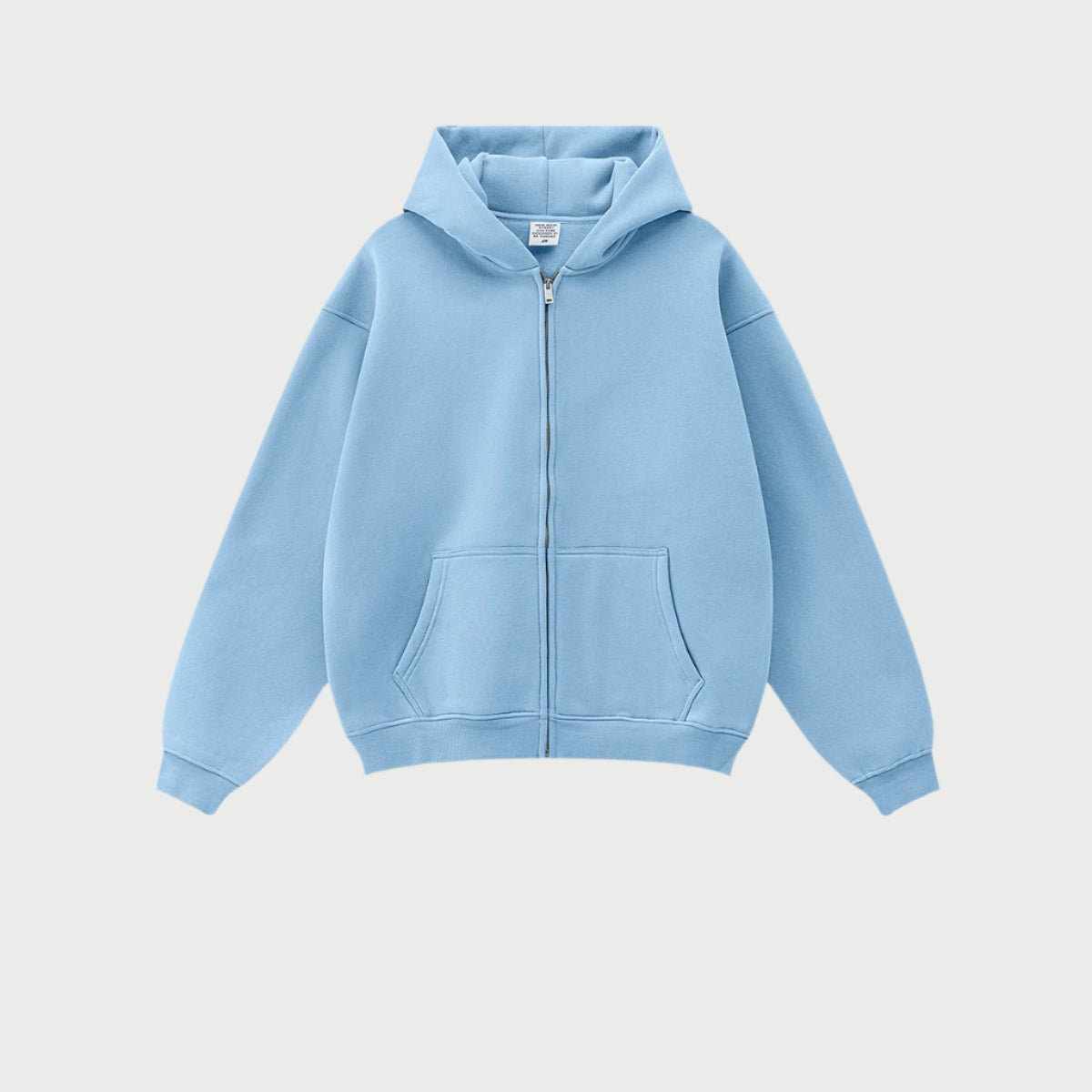 Light blue oversized zip-up hoodie with front kangaroo pocket and ribbed cuffs displayed on light gray background