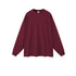 Burgundy oversized sweatshirt with crew neck and ribbed cuffs on plain background