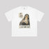 A white oversized graphic t-shirt with 'WHAT CAN I SAY' print displayed flat against grey background. Shows boxy fit and crew neckline