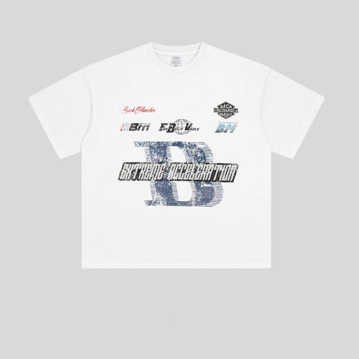 White oversized graphic t-shirt with blue B logo and Extreme Acceleration text displayed flat against gray backdrop