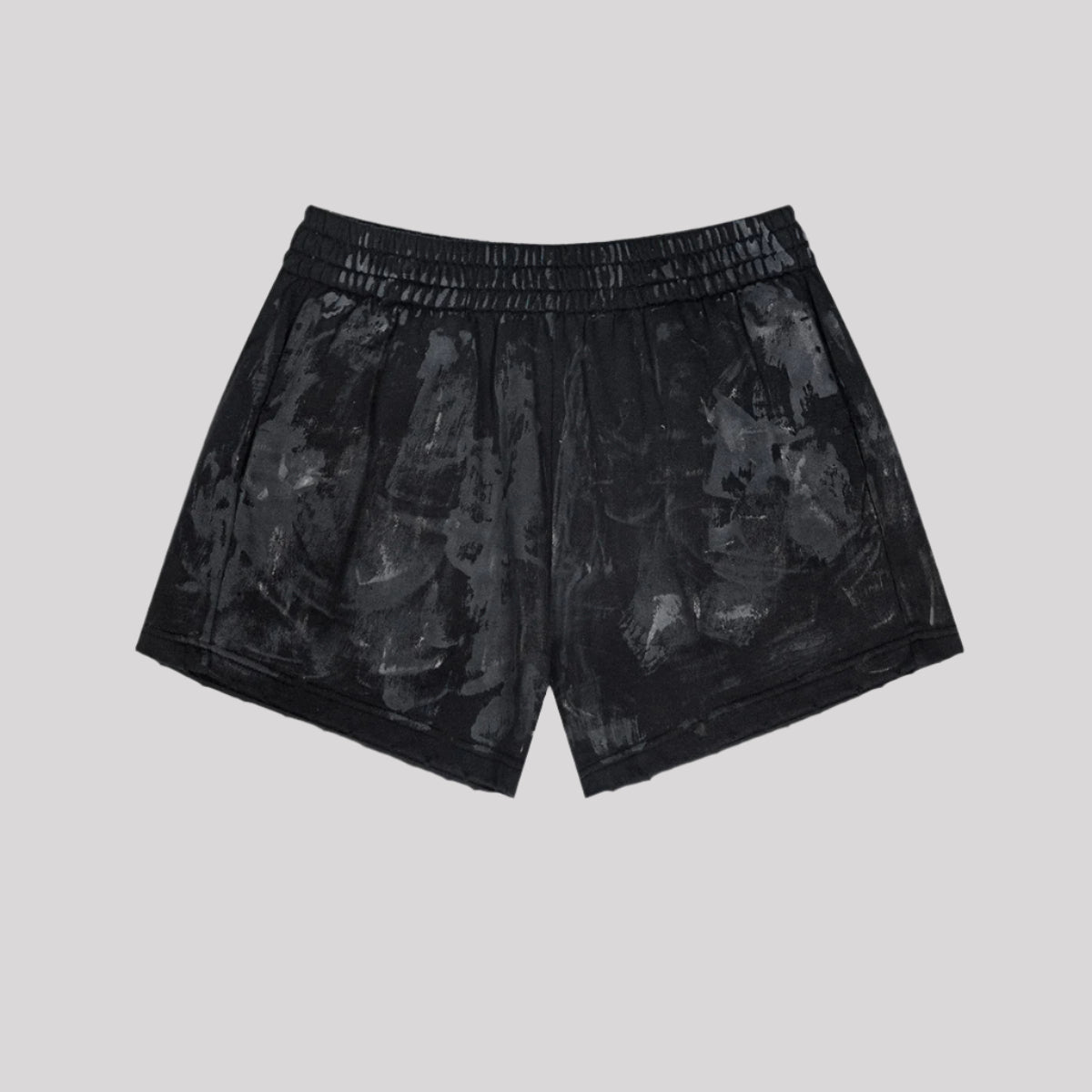 Black washed cotton shorts with elastic waistband and textured pattern on gray background