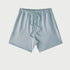 Pale blue drawstring shorts displayed flat against light gray background with elastic waistband