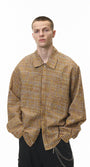 Dark-brown plaid shirt close-up at waist, pocket and hem