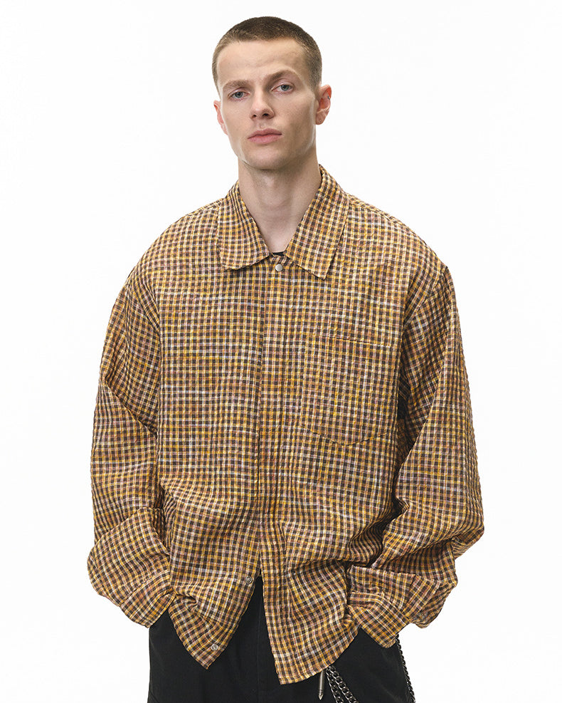 Dark-brown plaid shirt close-up at waist, pocket and hem