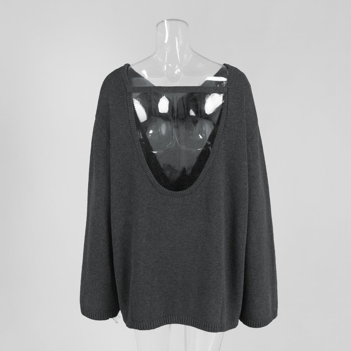 Back view of dark gray backless knit sweater with scoop open back