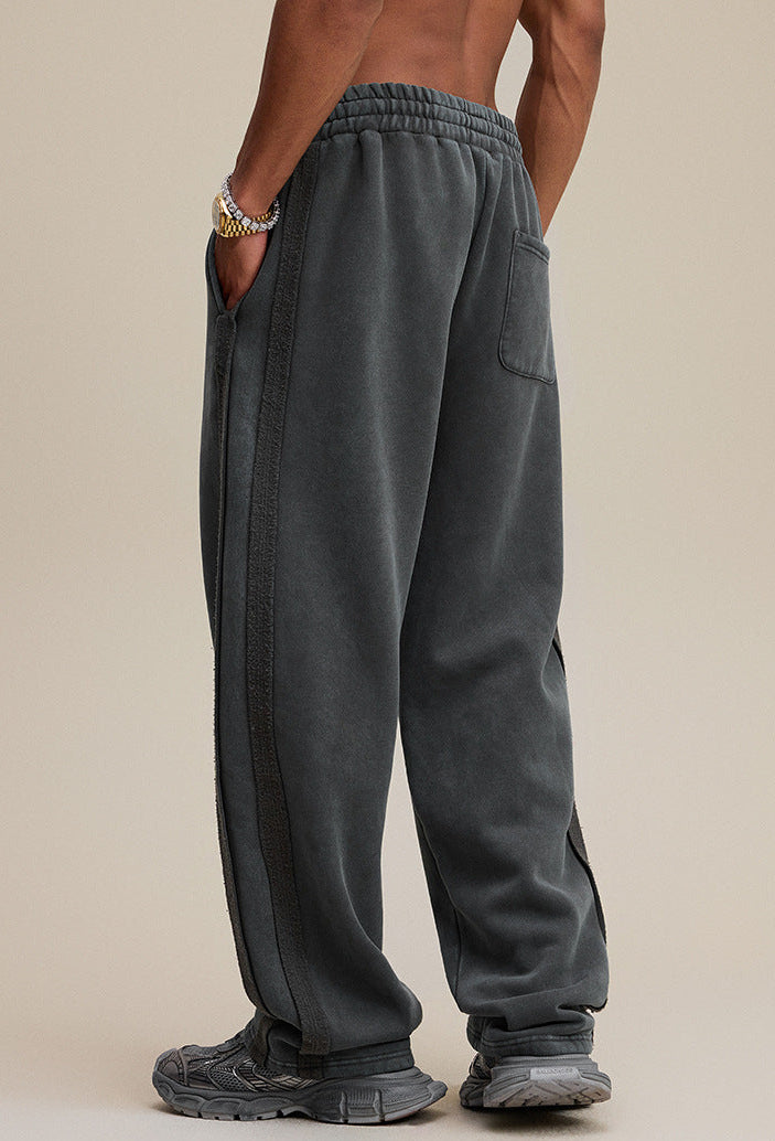 Dark gray baggy sweatpants, back view with single pocket