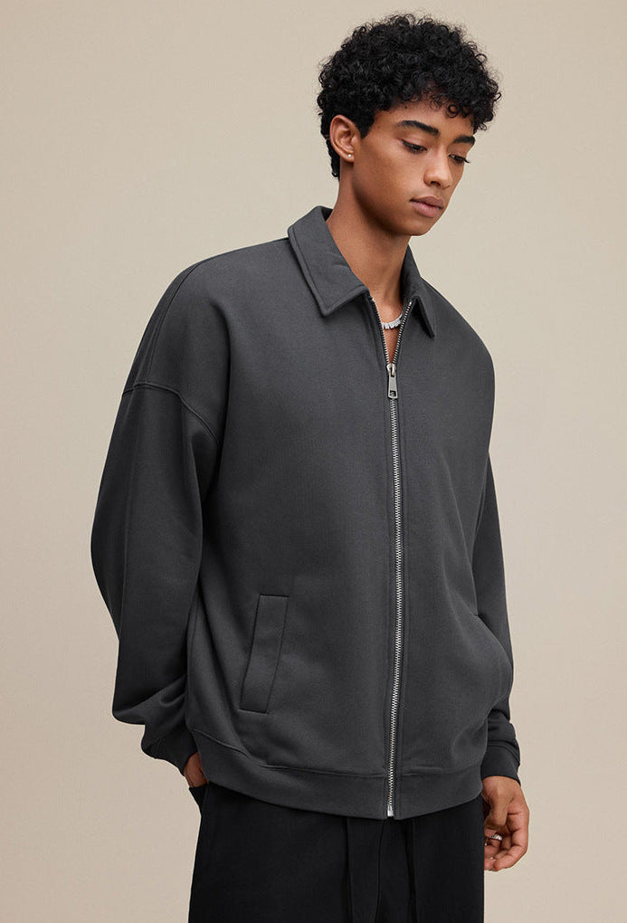 Dark gray polo zip up, three-quarter pose