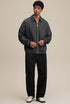 Model in dark gray collared zip sweatshirt, full front