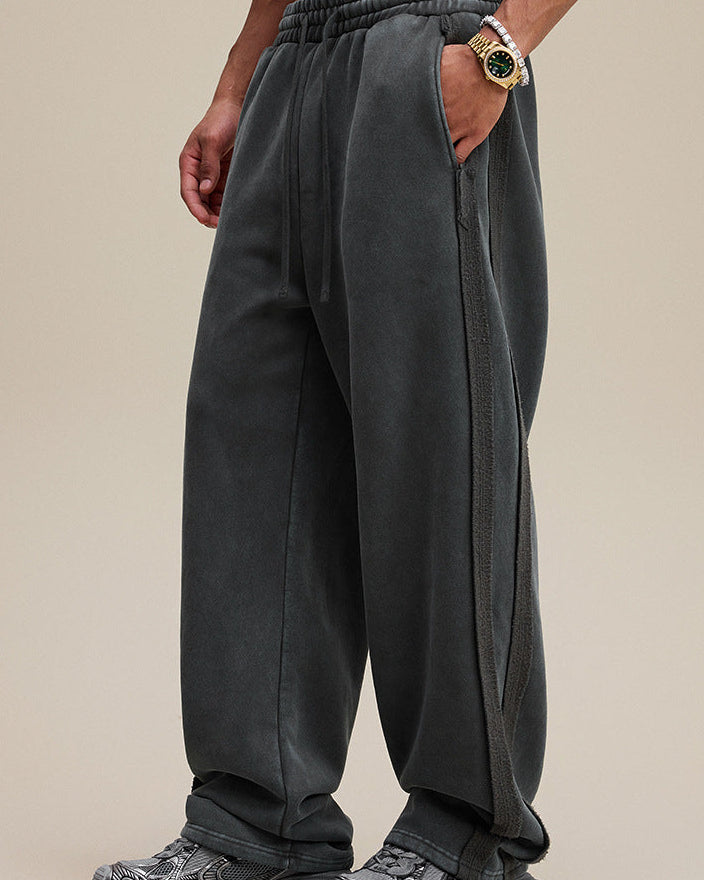 Dark gray wide leg sweatpants, side view showing drape