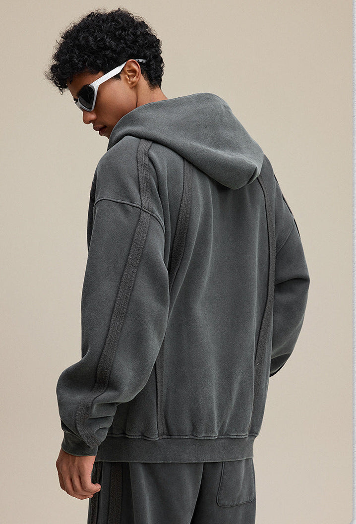 Dark gray zip hoodie back view with oversized hood and rib hem