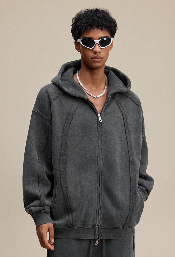 Dark gray zip hoodie hood-up look, fleece lining at edge visible