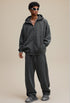 Model full outfit in dark gray zip hoodie and pants, oversized fit