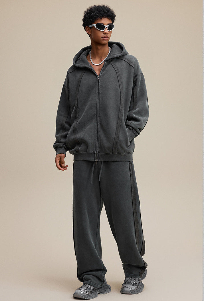 Model full outfit in dark gray zip hoodie and pants, oversized fit
