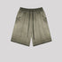 Olive green washed cotton shorts with elastic waistband and side pockets displayed flat against light gray background
