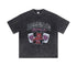 Flat lay of washed black "Deserve" devil graphic tee with flame cards.
