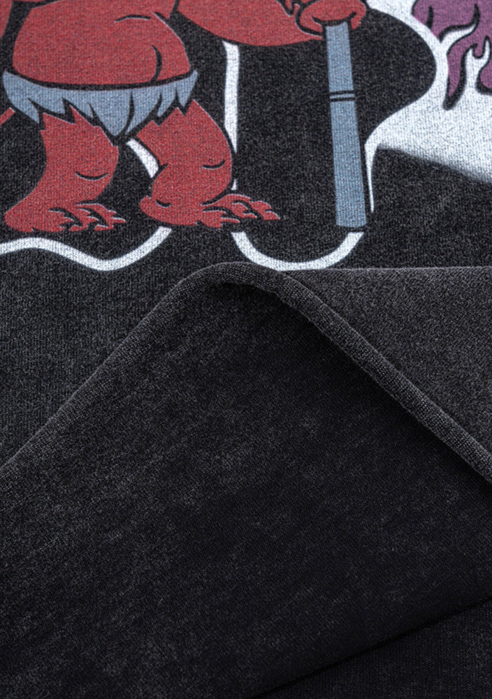 Close-up of devil graphic with inside-out view of stitched hem.