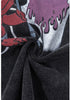 Detailed view of devil graphic and soft cotton fabric texture.