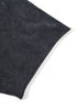 Close-up of black short sleeve hem on washed cotton T-shirt.