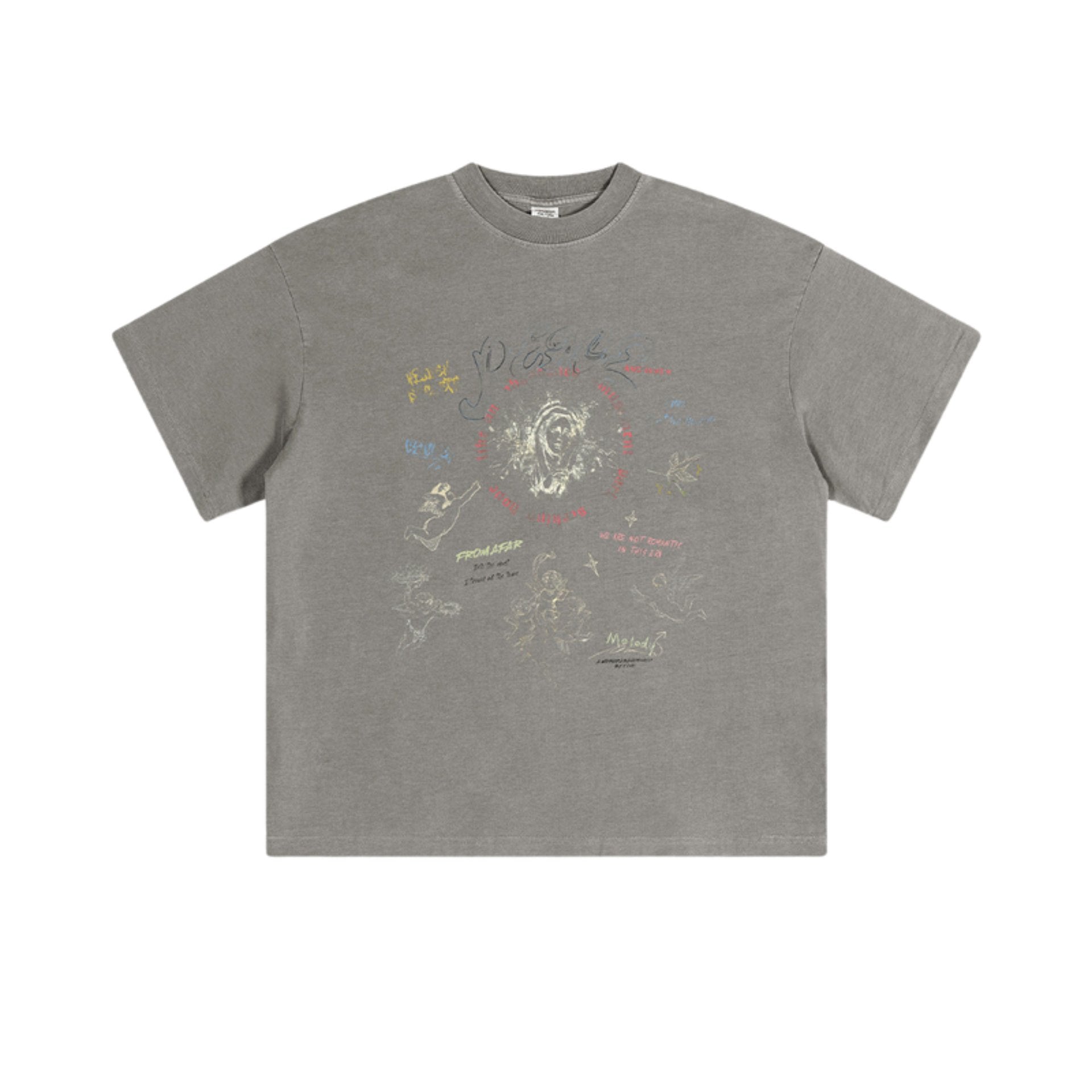 Flat lay of light gray oversized tee with artistic hand-drawn graphics