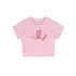 Flat lay of a pink cropped t-shirt with a pink devil girl and snake graphic
