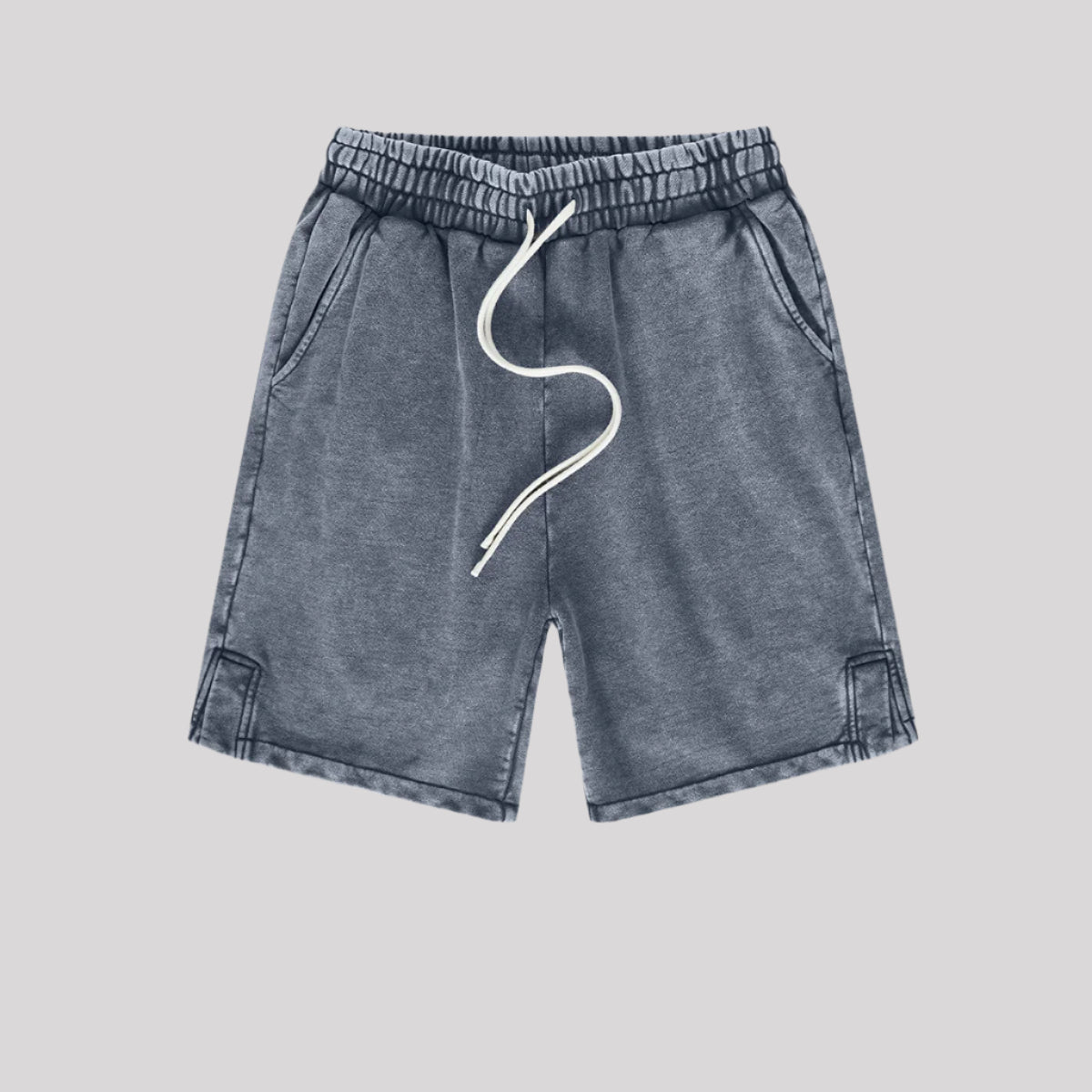 A pair of blue washed drawstring shorts with an elastic waistband, side pockets, and a casual, relaxed fit
