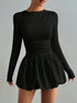 Elegant black mini dress with bubble skirt fitted long sleeve top