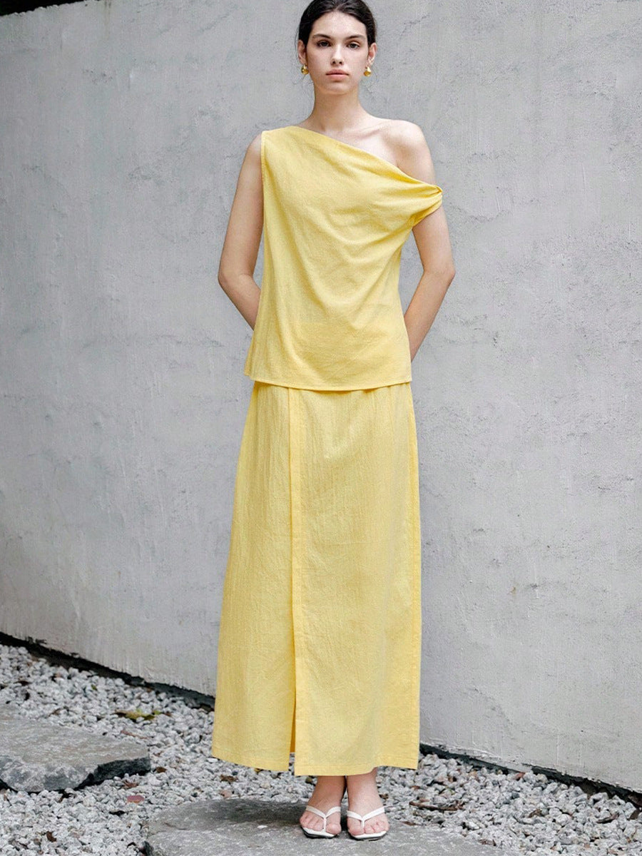 Elegant yellow skirt set with asymmetric one shoulder sleeveless blouse