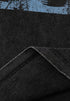 Folded edge of T-shirt fabric showing stitching.