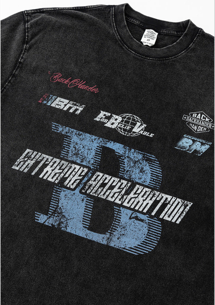 Flat lay of black graphic tee showing chest print details.