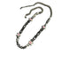 Evil eye beaded necklace with chunky metal chain on white background.