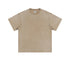 Product shot of beige acid-washed oversized t-shirt with crew neck and short sleeves on plain background