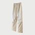 Beige wide-leg utility pants with paneled design and white drawstring displayed flat