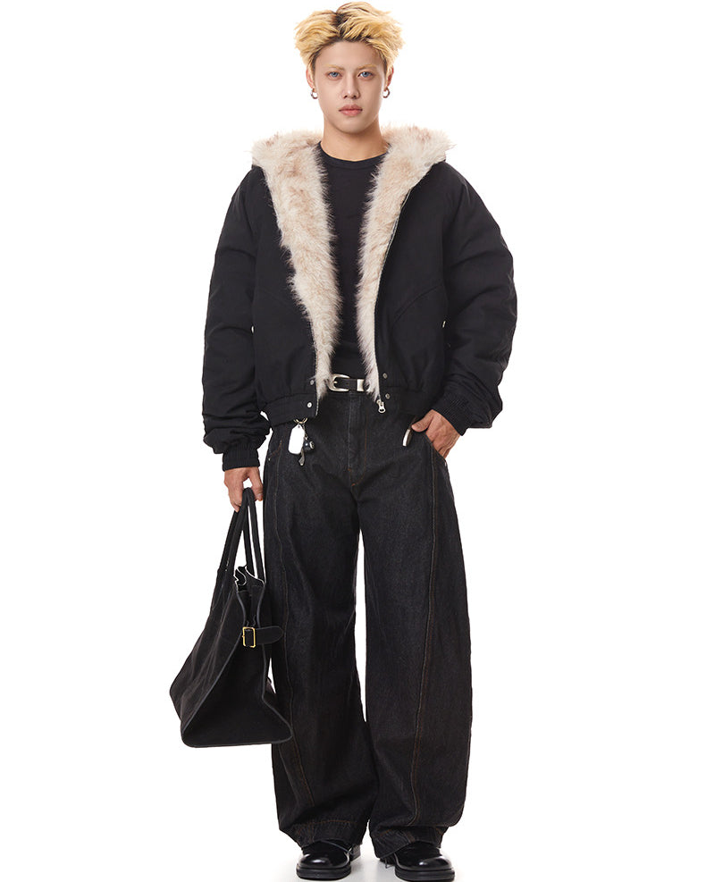 Front full-body view of black relaxed fit faux fur hood bomber jacket worn open over dark t-shirt and wide-leg jeans.