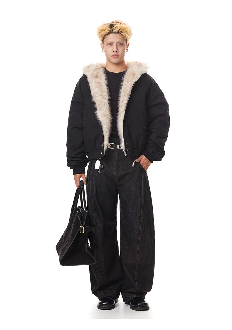 Front full-body view of black relaxed fit faux fur hood bomber jacket worn open over dark t-shirt and wide-leg jeans.