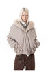 Waist-up front view of taupe padded bomber jacket featuring wide plush fur lapel collar.