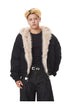 Medium close-up of black heavy bomber jacket highlighting wide plush faux fur collar lining.