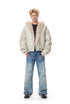 Front full-body view of off-white beige padded bomber jacket with plush faux fur hood lining.