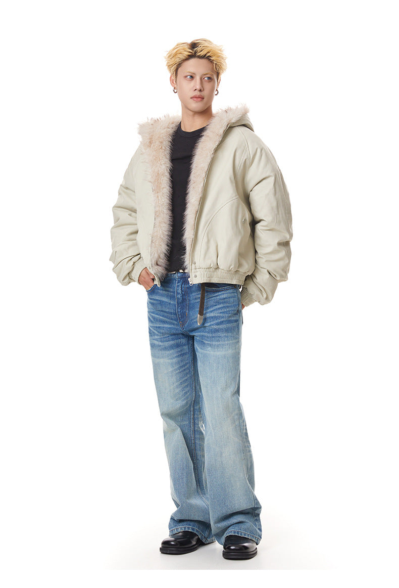 Full-length shot of beige relaxed fit winter bomber jacket styled with blue jeans.
