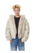 Medium shot of beige oversized padded jacket featuring wide plush fur lapels.