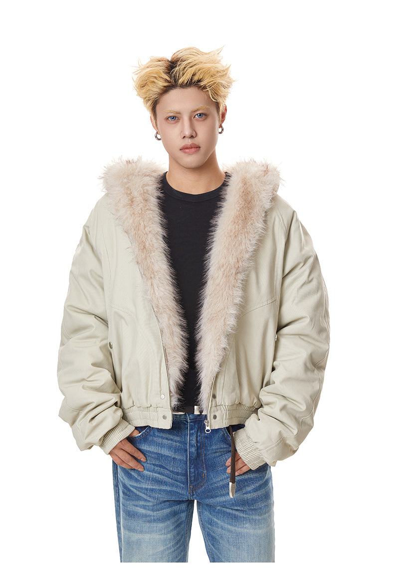 Medium shot of beige oversized padded jacket featuring wide plush fur lapels.