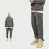 Model in charcoal gray hoodie and matching sweatpants with white undershirt and beige Jordan sneakers in split-view format