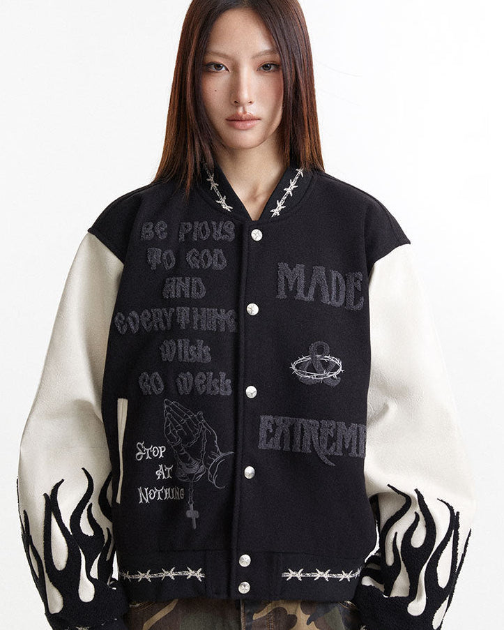 Oversized embroidered varsity jacket front view with cream flame sleeves and snap buttons