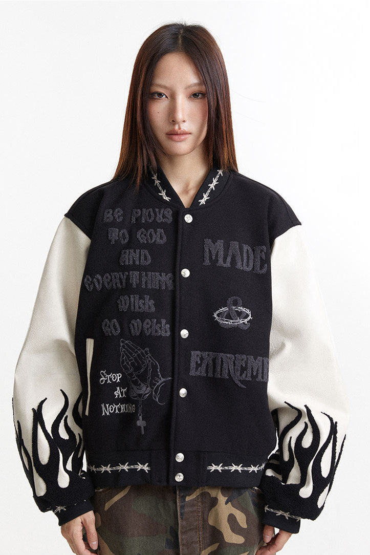 Oversized embroidered varsity jacket front view with cream flame sleeves and snap buttons