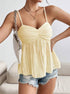 Women wearing yellow cami tank styled with denim shorts for summer look