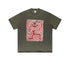 Flat lay of olive green graphic tee with red skeleton and flower design.