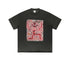 Flat lay of rust black t-shirt with red skeleton and floral graffiti design.