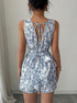 Back of casual sleeveless romper in floral pattern