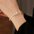 side-angle view of the gold pearl cuff bracelet worn on the wrist