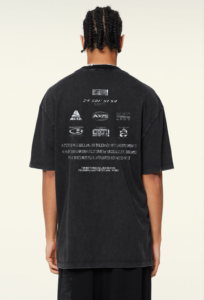 Back view of graphic tee with multiple logos and motivational text